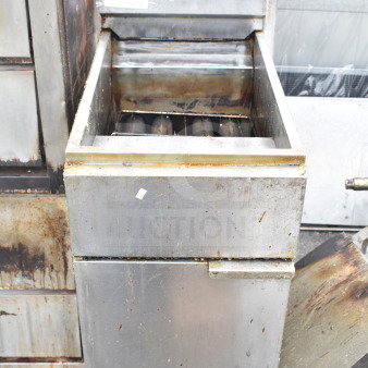 Commercial gas-powered floor style deep fat fryer, visible wear, robust design, identification tag with number 286 visible.