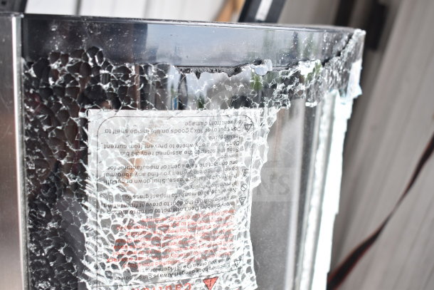 KoolMore CDUR-3C circular refrigerated bakery case with visible glass damage. 110-120 volts, 1 phase.