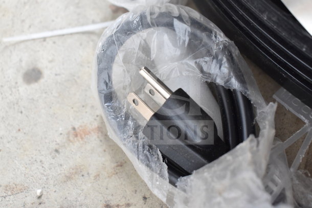 KoolMore CDUR-3C bakery display case power cord wrapped in plastic. 110-120 volts, 1 phase.