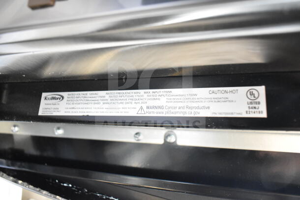KoolMore KM-CWO24-AFSS microwave oven label showing voltage, frequency, input/output, manufacturing date, and safety warnings.