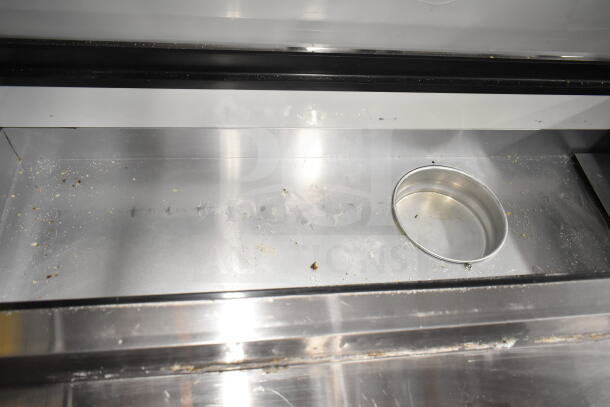 2023 Motak MPR-83-X pizza prep table surface, showing stainless steel condition and circular cutout, on casters.