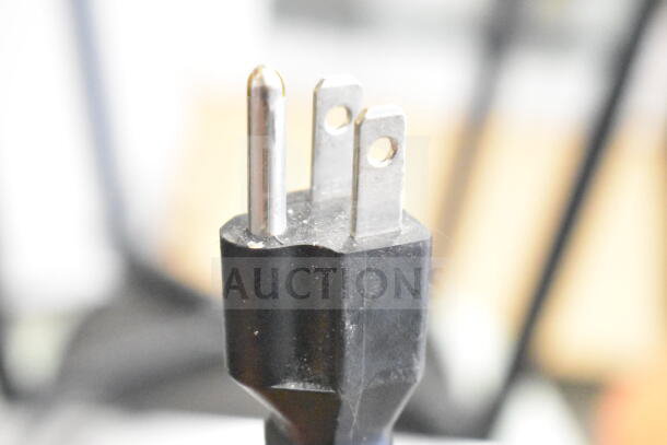 Close-up of a power plug for the Motak MPR-83-X Commercial Pizza Prep Table. Black three-prong plug detail.