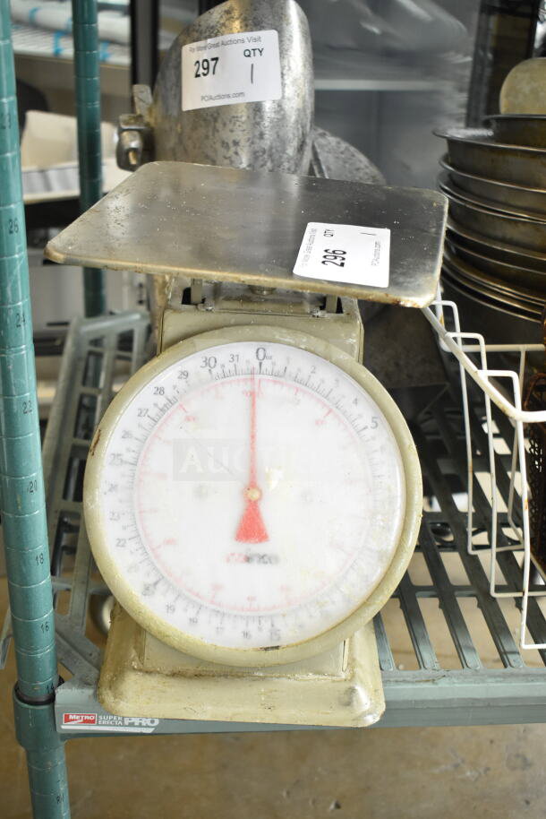 Winco SCLH-2 countertop scale, vintage design, visible wear, clear dial, sturdy metal platform, auction tags attached.
