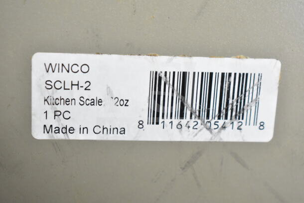 Winco SCLH-2 countertop kitchen scale label, 32 oz capacity, 1 piece, made in China, with barcode visible.
