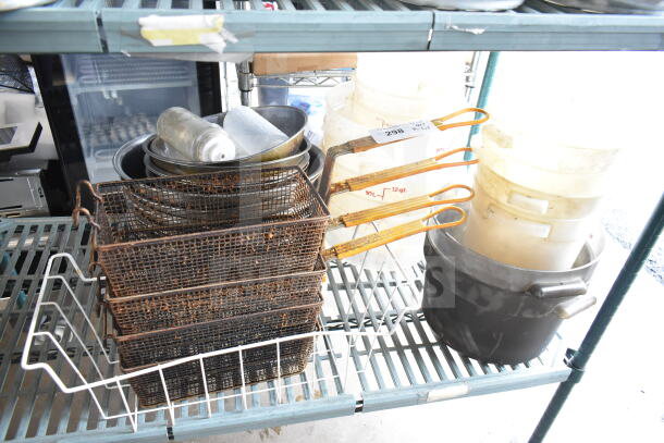 Lot of kitchen items including rusted fry baskets, metal bowls, and marked plastic containers on shelf.