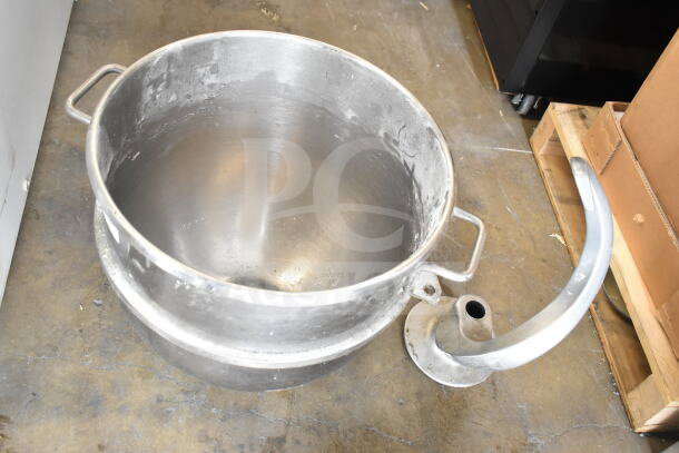 Stainless steel mixing bowl and dough hook attachment for Hobart mixer. Light wear visible, suitable for commercial use.