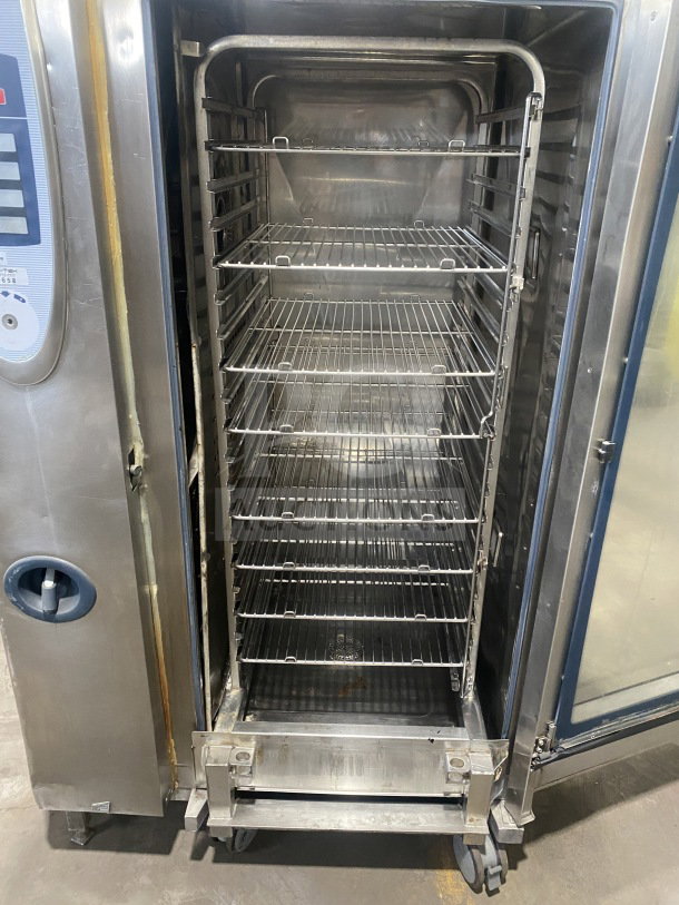 Rational SCC202 commercial combi oven with wired rack, stainless steel, electric, full-size, 208V, 3 phase, on casters.