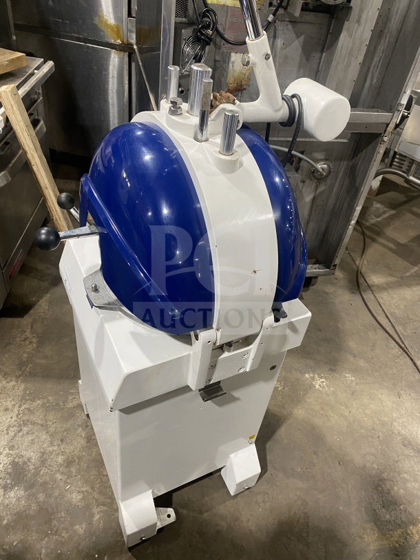 Doyon electric semi-automatic dough divider/rounder, white and blue, sturdy build, excellent condition. Ideal for commercial use.