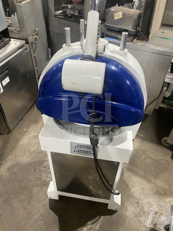 Doyon commercial dough divider/rounder, electric, white and blue, semi-automatic, visible "Danger Electricity" label.