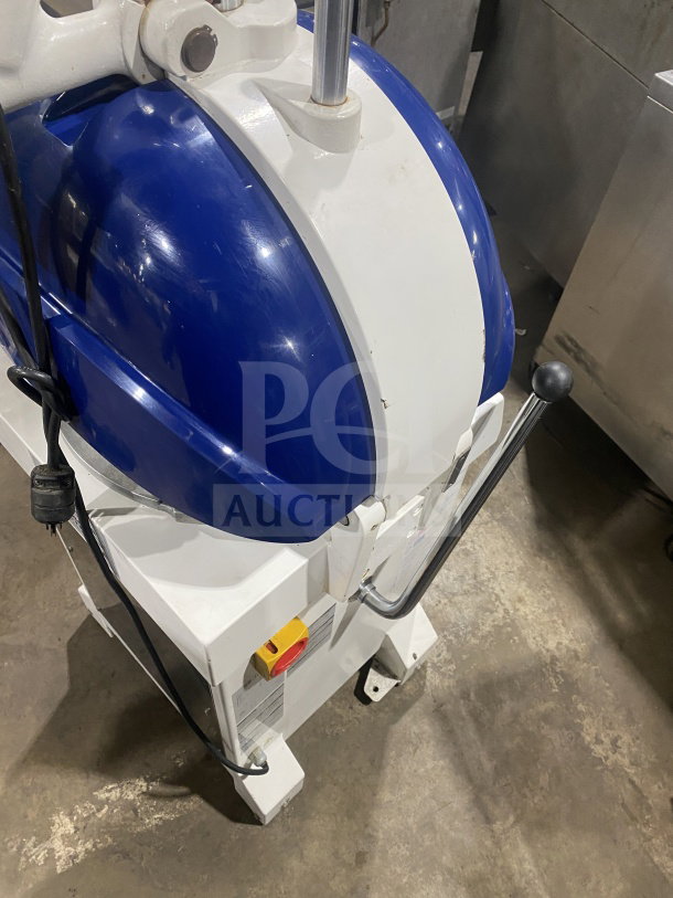 Doyon commercial electric dough divider/rounder; white and blue; semi-automatic; good condition; visible control lever.