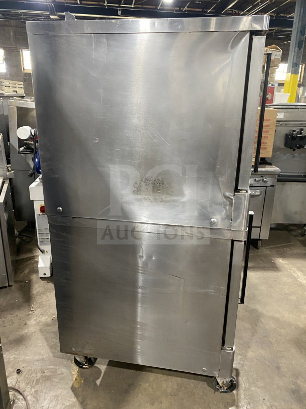 Blodgett stainless steel gas-powered double convection oven, Energy Star certified, with wired rack, on legs, with casters.