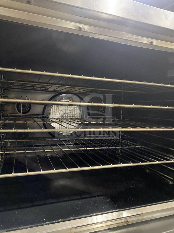 Blodgett commercial stainless steel gas convection oven, double stacked, with wired oven racks, on casters, Energy Star certified.