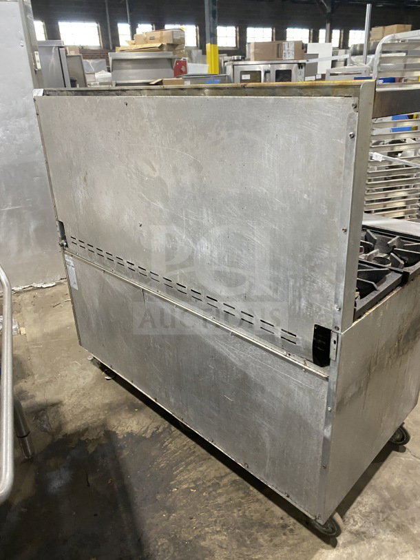 Bakers Pride stainless steel 10 burner range with double oven, backsplash, overhead salamander shelf, on casters, Model 955394604036.