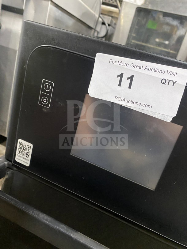 MerryChef Eikon E2S black countertop rapid cook oven, electric-powered, slight wear, auction tag showing "11 QTY" visible.
