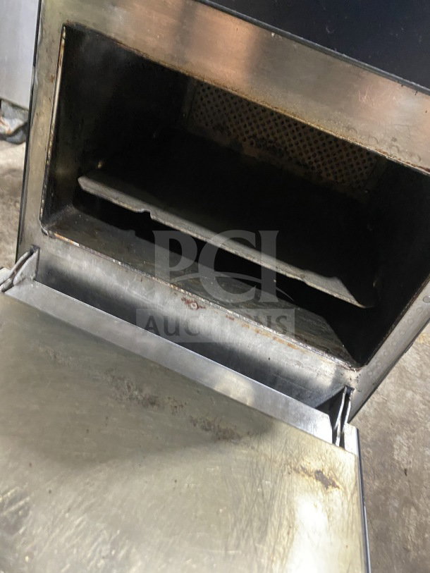 MerryChef Eikon E2S commercial rapid cook oven, black, electric, countertop model. Visible wear on the interior.