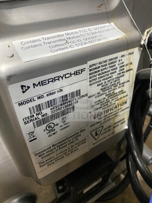 MerryChef Eikon E2S commercial rapid cook oven, model and serial labels visible, black, electric-powered, countertop design.