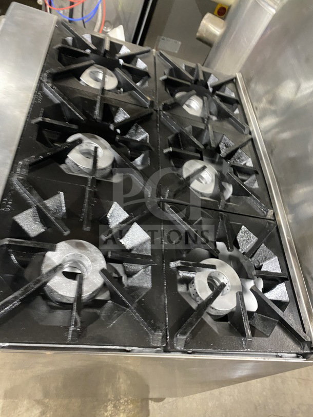 CookRite 6-burner commercial stainless steel gas range/oven combo with backsplash, salamander shelf, wired oven rack, on casters.