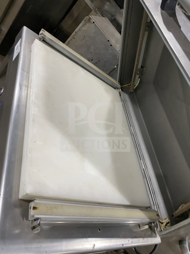 Promax commercial stainless steel vacuum tray sealer with digital controls, single chamber, on casters, in good condition.
