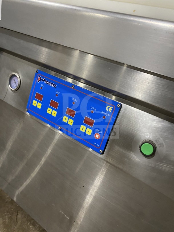 Promax stainless steel vacuum tray sealer with digital controls; single chamber, electric-powered on casters, excellent condition.