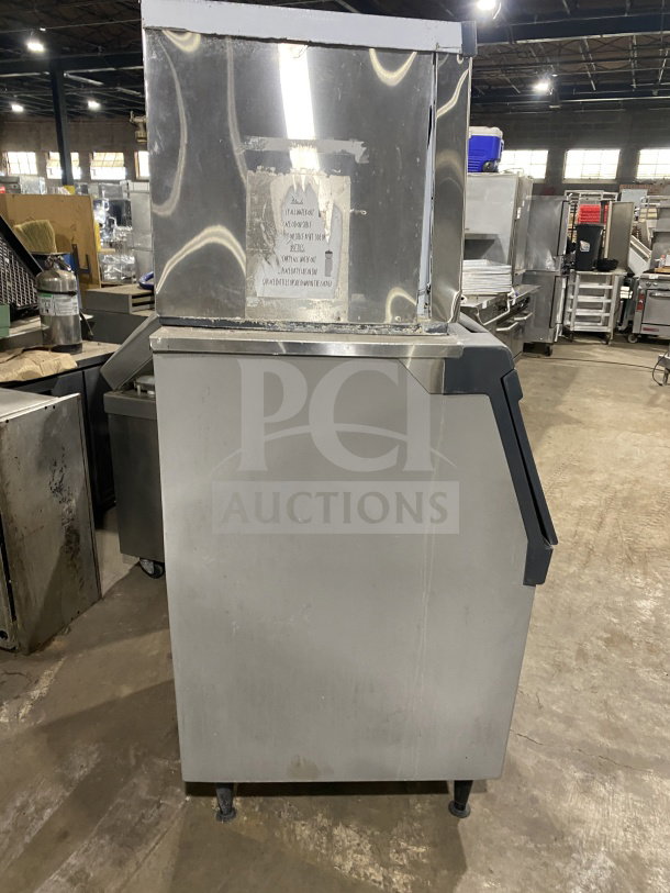Scotsman Prodigy Series N0422W1A water-cooled ice machine, stainless steel, electric, 115V, on legs, in warehouse setting.