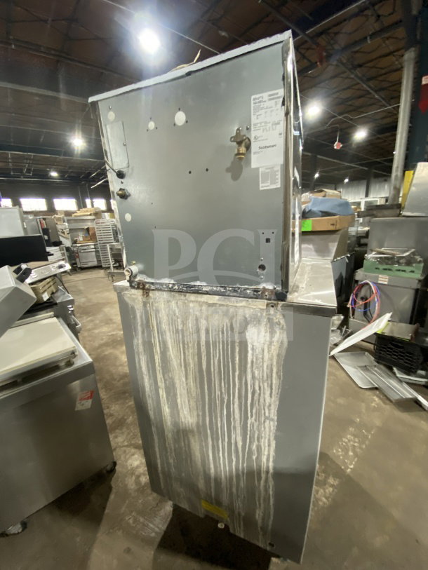 Scotsman Prodigy Series ice machine, model N0422W-1A, stainless steel, electric, water-cooled, on legs. Visible wear.