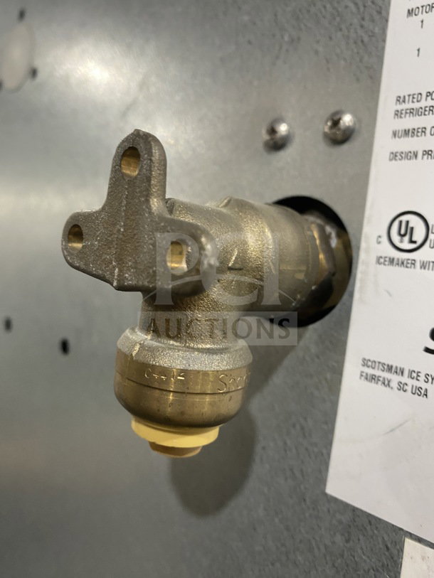 Scotsman Prodigy N0422W-1A ice maker water inlet and UL label on stainless steel casing.