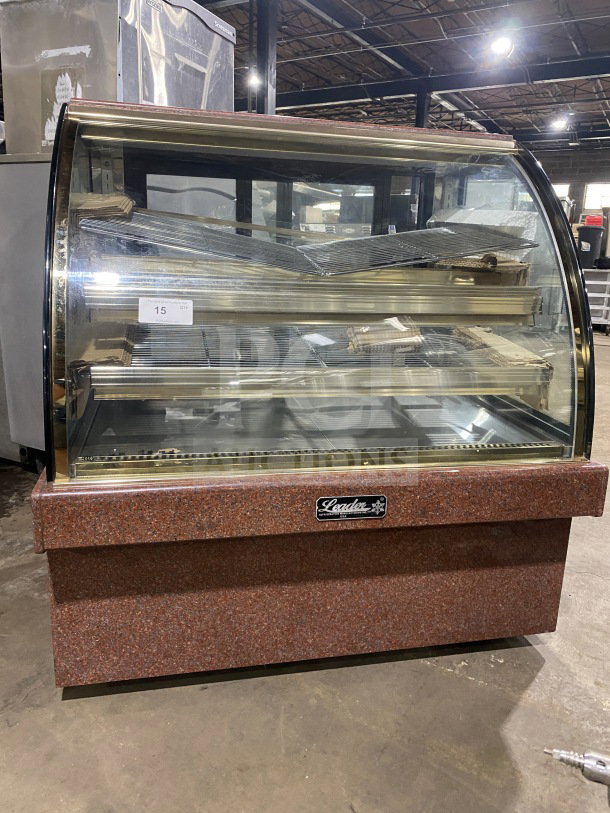 Leader Commercial 48" curved glass dry bakery display case, model EMCB48D. Excellent condition, marble base, transparent shelves.