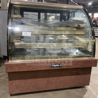 Leader Commercial 48" curved glass dry bakery display case, model EMCB48D. Excellent condition, marble base, transparent shelves.