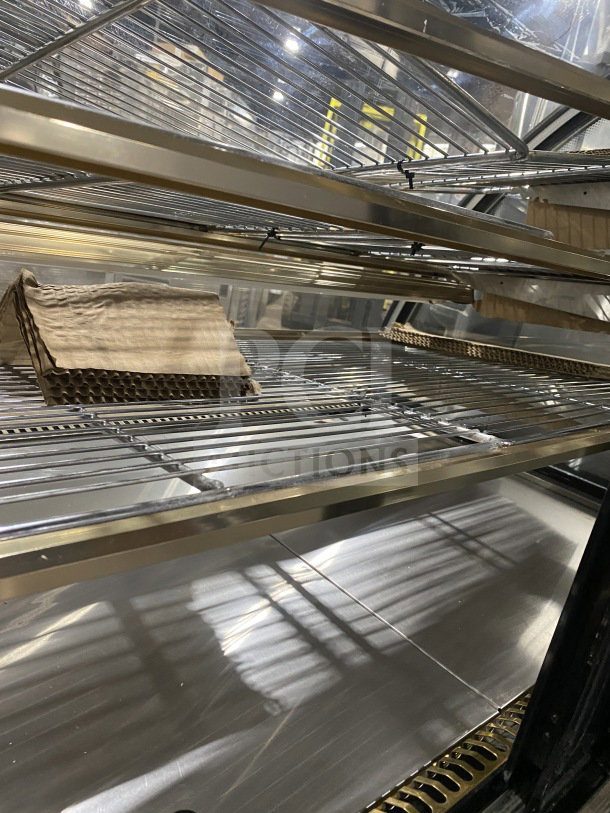 Leader Commercial 48" Curved Glass Dry Bakery Display Case, Model EMCB48D. Clean shelves, excellent condition.