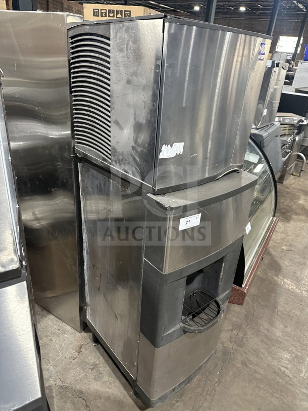 Manitowoc SD0423W stainless steel water-cooled ice machine with dispensing bin, 115V, on legs. Visible wear.