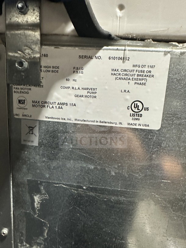 Manitowoc ice machine label, silver with model SPA310 details, NSF and UL certifications, serial number 610106152.