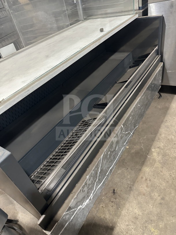 Commercial electric-powered refrigerated open-air display merchandiser, 220V, 1 phase, metal and glass construction, used condition.