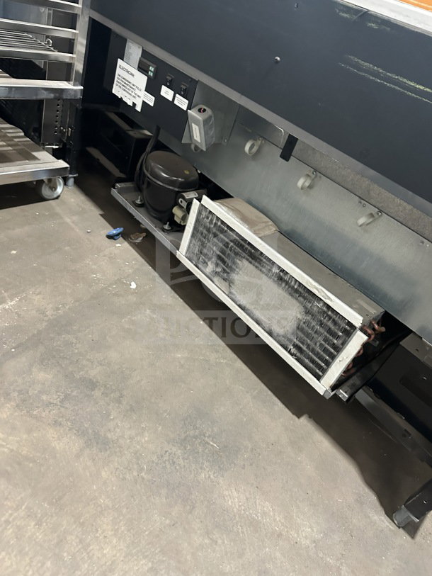 Commercial electric refrigerated open-air display merchandiser, 220V, 1 phase. Features control panel and cooling components.