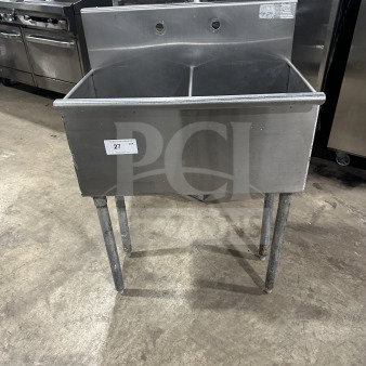 Commercial stainless steel 2-compartment utility sink on legs, SN: 847962, with visible faucets holes and tag.