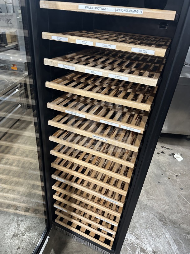 Eurodib USF168S single door wine cooler with wooden shelves, model USF-168S, 110/120V, labels indicate wine storage.