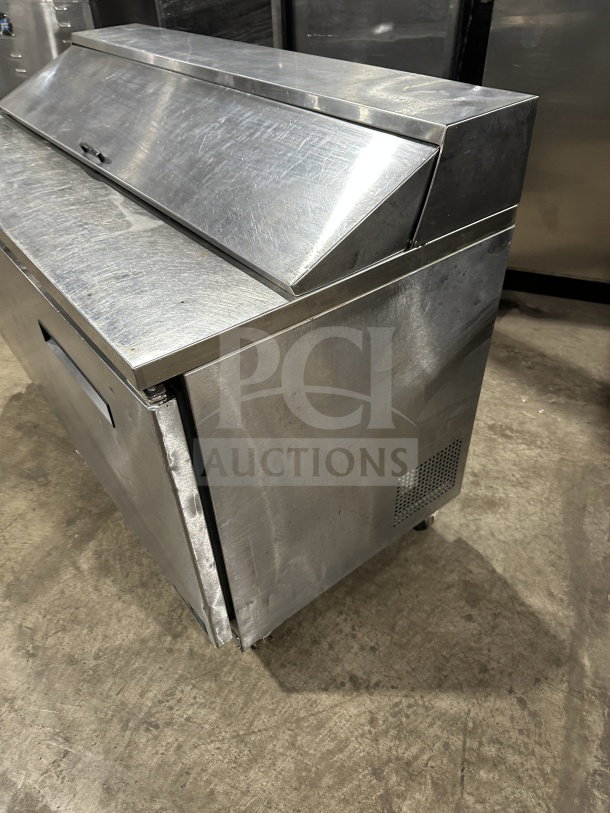 Asber PTS-60-16 60 stainless steel 2-door refrigerated prep table, used, on casters, ideal for sandwiches/salads.