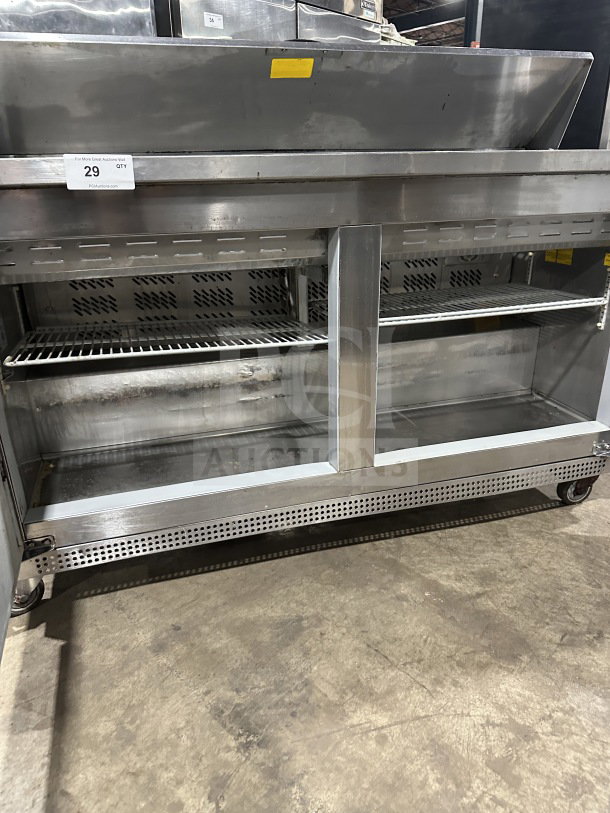 Asber PTS-60-16 60 stainless steel 2-door refrigerated prep table on casters, good condition, shelves visible.