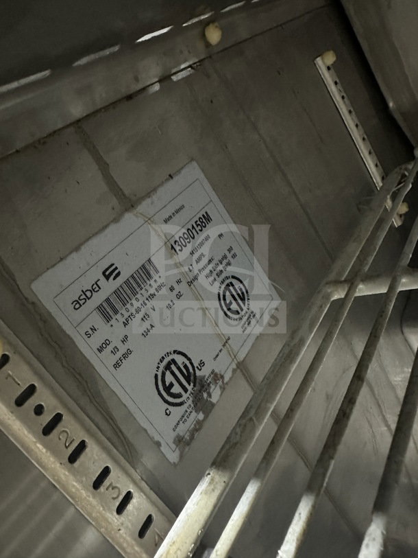 Asber stainless steel refrigerated prep table, model PTS-60-16 60. Two-door, on casters. Serial number 1309158M visible.