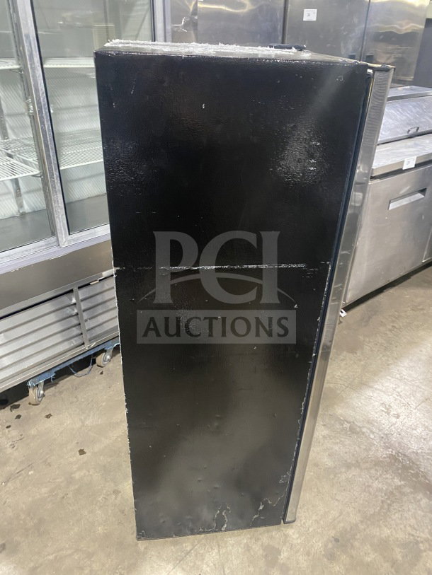 Frigidaire EFRF694 stainless steel single door upright freezer with poly-coated wired rack, 115V. Appears in used condition.