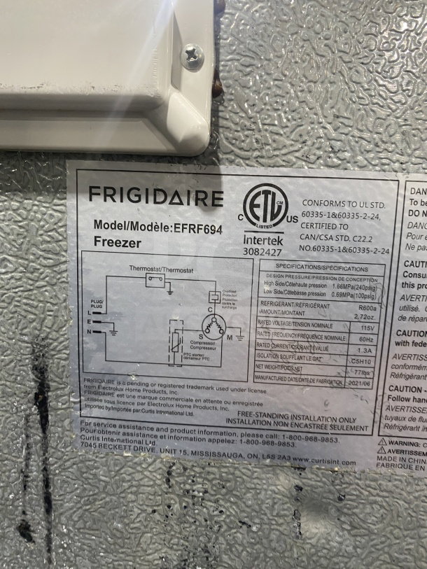 Frigidaire Model EFRF694 label showing specifications for a commercial stainless steel upright freezer, 115V power.