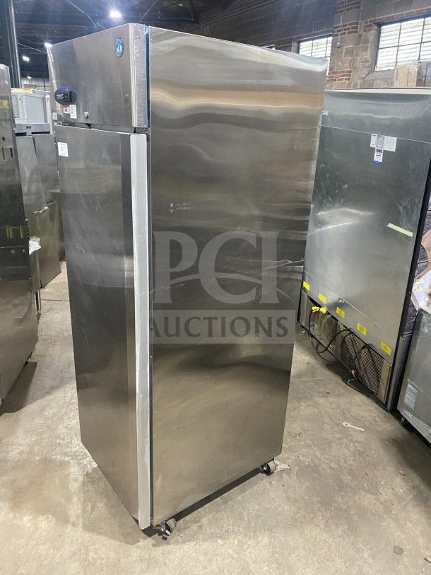 Hoshizaki CF1B+FSL stainless steel commercial upright freezer, single solid door, poly coated wired rack, on casters.