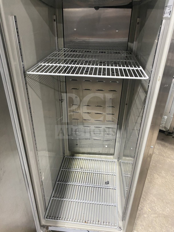 Hoshizaki stainless steel single door upright freezer, model CF1B-FSL, with poly-coated wire rack, on casters.
