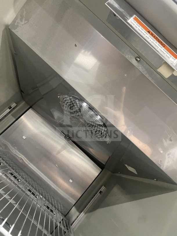 Hoshizaki commercial stainless steel upright freezer, model CF1B+FSL, with poly-coated wired rack, SN D60094F, on casters.
