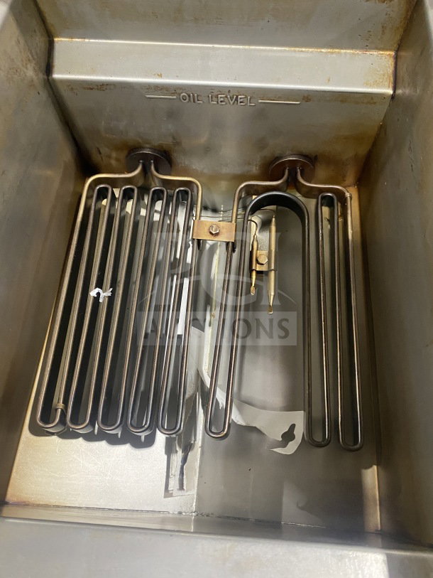 Imperial IFS50E stainless steel electric deep fryer with fry basket, splash back, on casters; visible oil level marking.