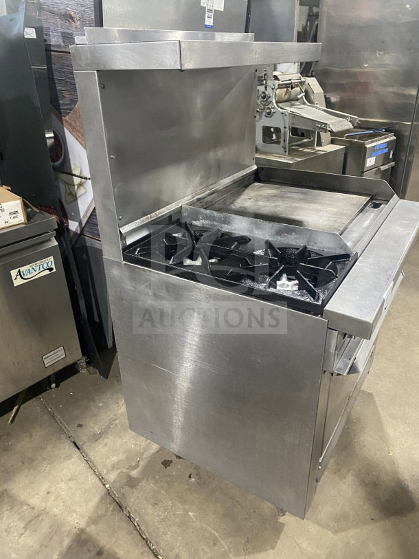 Commercial stainless steel 2-burner gas range with plancha grill, convection oven, wired rack, and splash back.