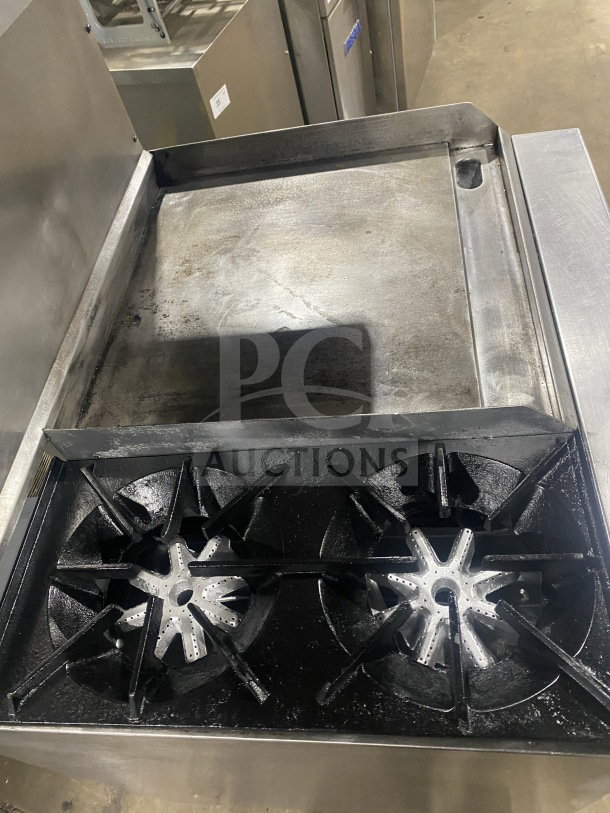 Commercial stainless steel gas range with 2 burners, plancha grill, and convection oven. Includes wired rack and splash back.