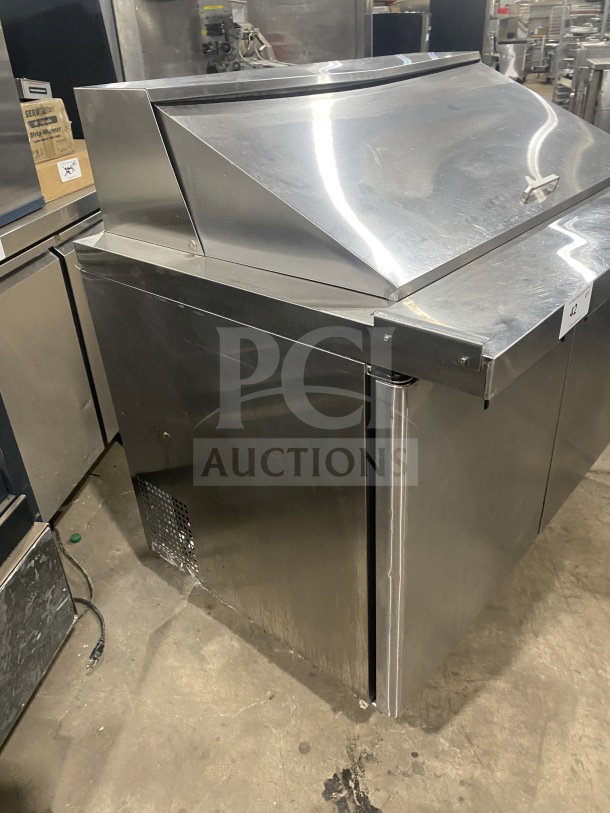Bison BST4818 stainless steel sandwich prep table, refrigerated mega top, 2-door storage, poly-coated rack, on casters.