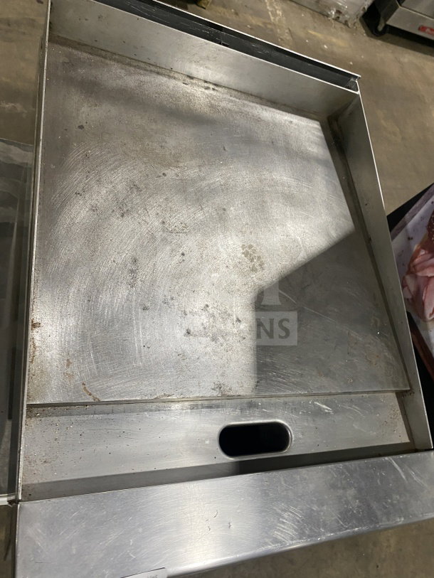Garland G1GG24-G24 stainless steel countertop flat griddle, natural gas, with back and side splash, on legs, used condition.