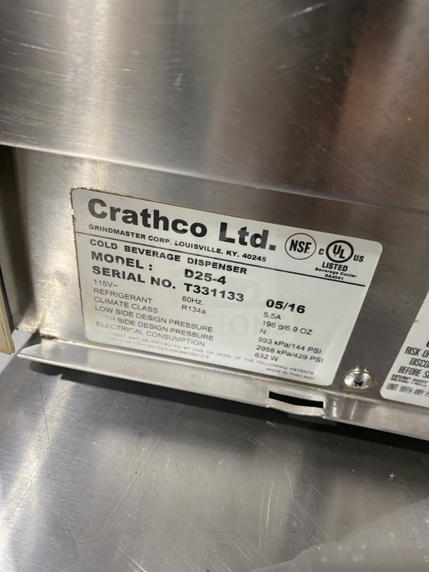 Crathco D25-4 stainless steel beverage dispenser label with model and serial number details.