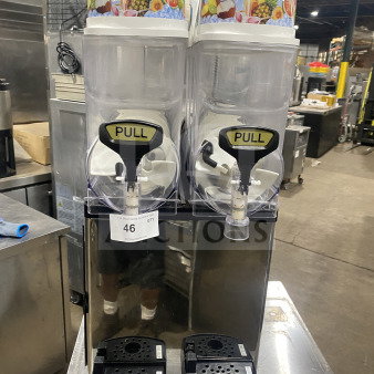 Icetro SSM280 stainless steel electric countertop twin slushy machine with clear polycarbonate hoppers and drip tray, 115V.